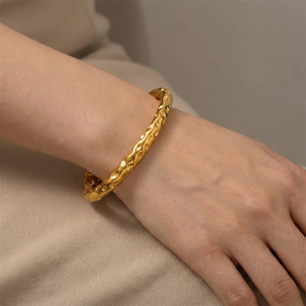 Radiant Resilience: Gold-Plated Hammered Stainless Steel Bracelet