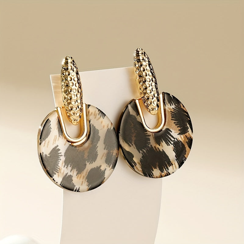 Pair of textured hoop earrings with exaggerated asymmetrical geometric posts for a sophisticated look.